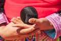 Hmong girl holding weave cotton rope ball.